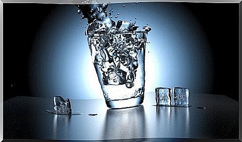 Glass of water and ice cubes