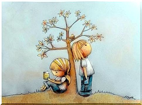 Boy and girl by a tree