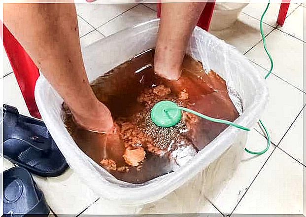 A person using a detox foot bath.