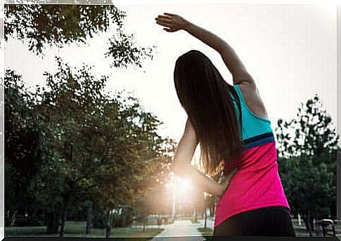 A jogger who stretches out before she runs.