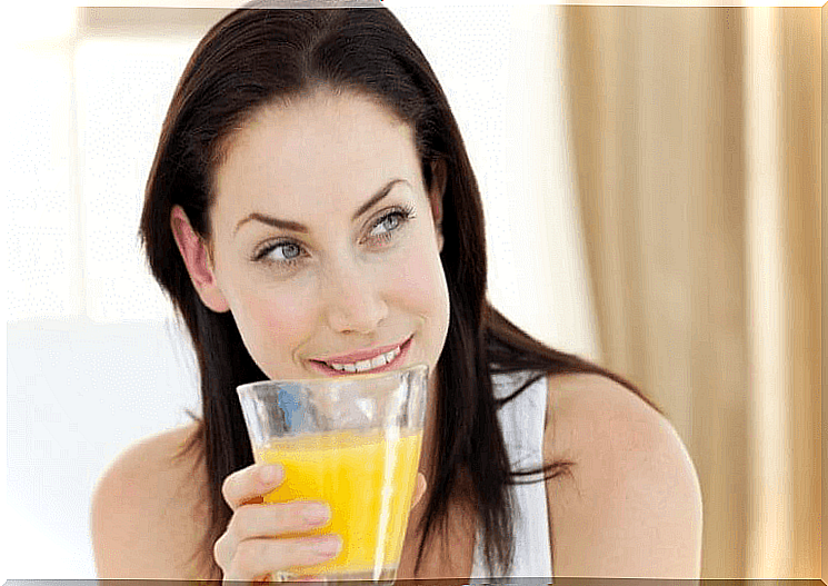 Woman drinking pineapple juice