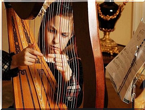 Girl playing harp - music therapy