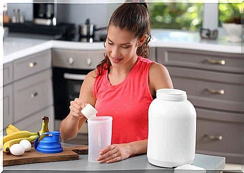 Woman making protein shakes