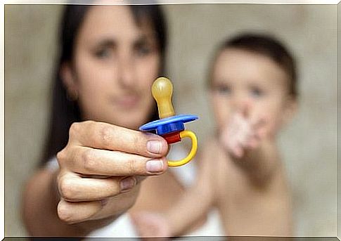 Woman holding pacifier