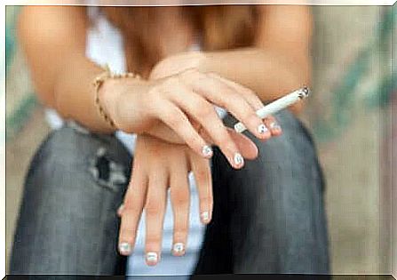 A teenager smokes.