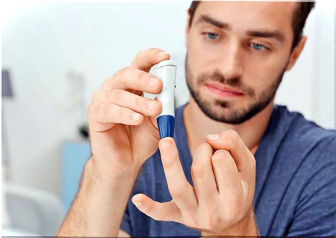 A man with diabetes measures glucose.